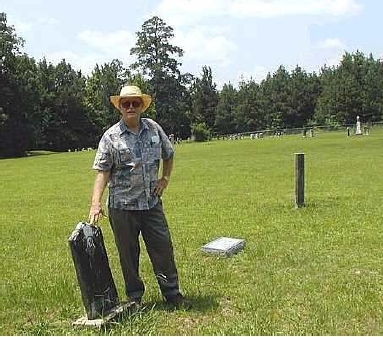 Marc Parrish of Georgetown, TX standing at Gus Witherington's gravestone